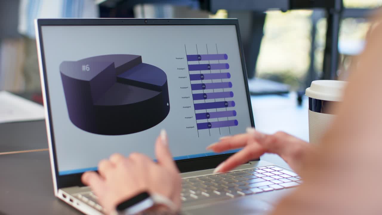 Opening laptop, female analyst updating data and navigating pie and bar charts at desk