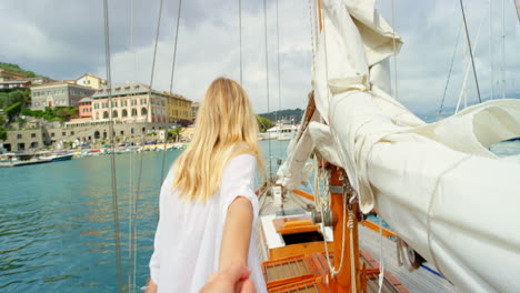happy woman leading her friend holding her hand to