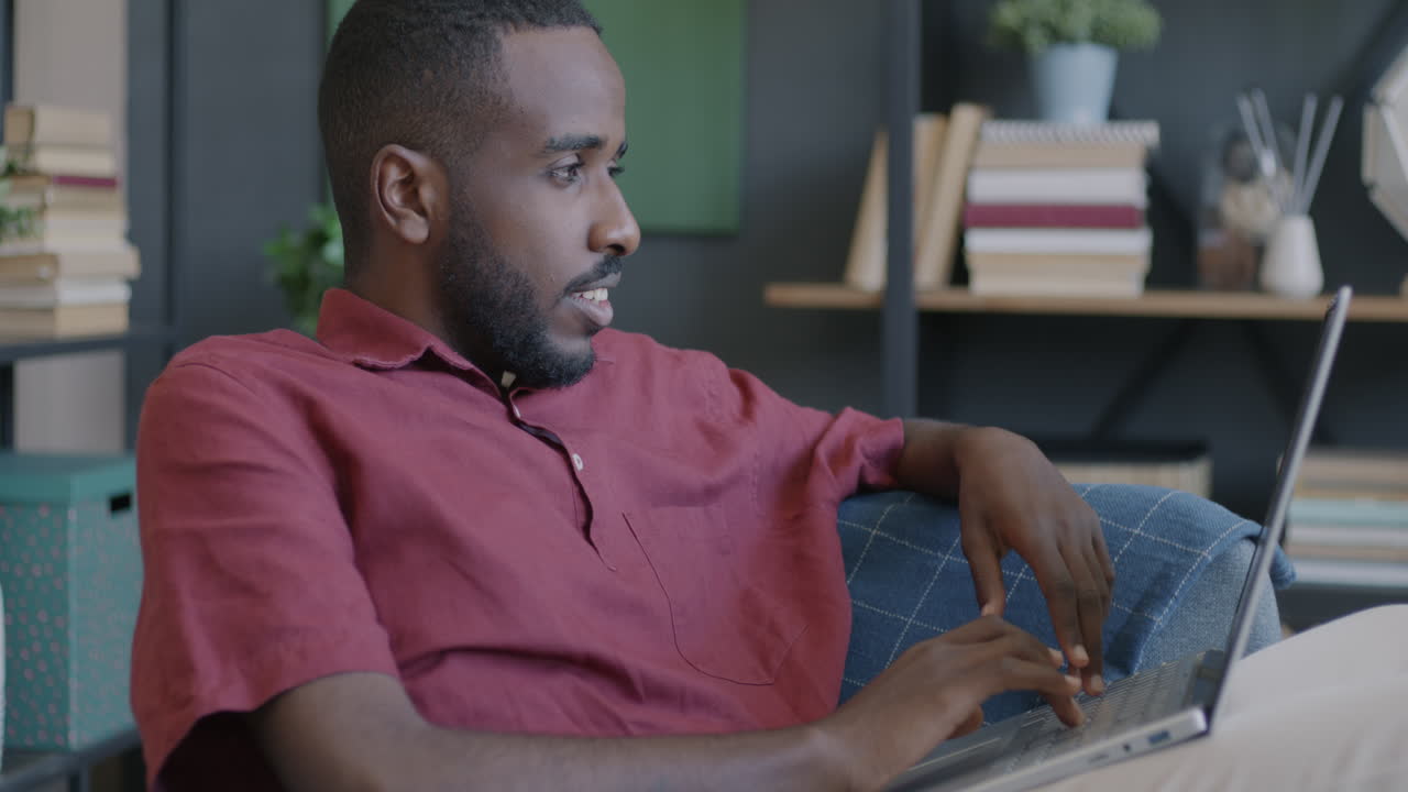 Man working on a laptop at home