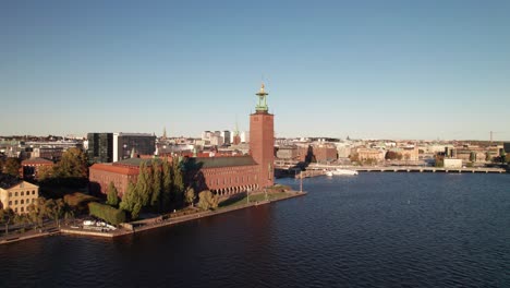 Stockholm-City-Hall-and-skyline,-360-aerial-at-golden-hour-4K