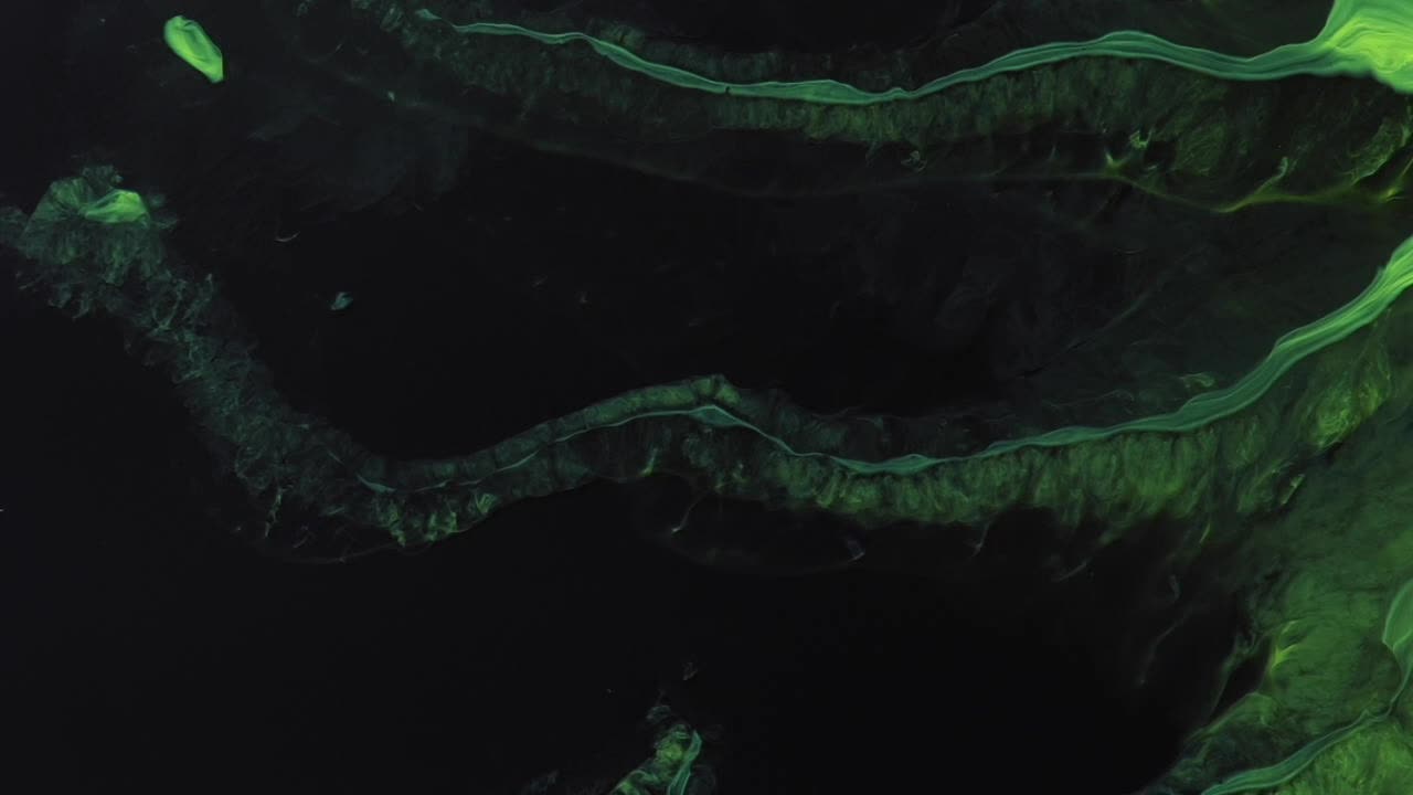 The Green Being, light years from here, arms ashimmer,  moves slowly through the vast black of space -  For more, search  "AbstractVideoClip" using the quotation marks