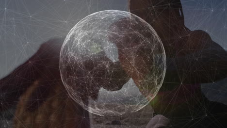 woman interacting outdoors, supporting holographic sphere, with network mesh in technology concept