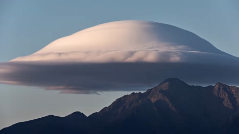 lenticular cloud over mountain range