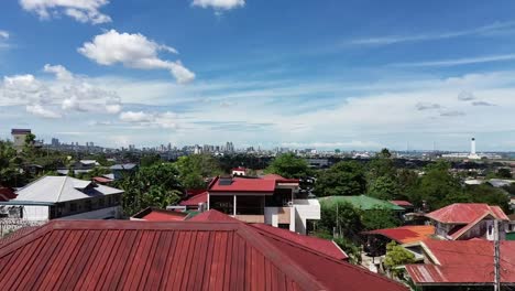 Pedestal-drone-shot-of-Cebu-City-in-the-Philippines-from-a-residential-area-overlooking-the-city