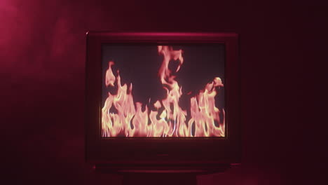 vintage tv with flames on screen
