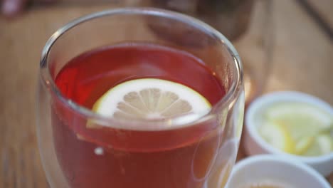 close up of a glass of lemon tea