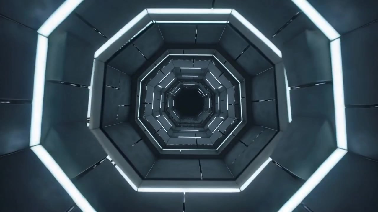 La telecamera avanza esplorando l'interno di un pozzo poligonale con un mozzo centrale e anelli LED, avvicinandosi al nucleo.
