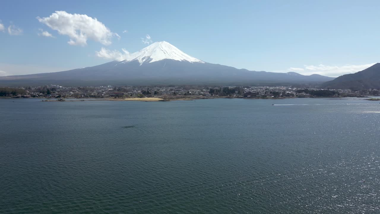 Aerial cinematic drone flight over Mt. Fuji in spring at Lake Kawaguchiko in Japan