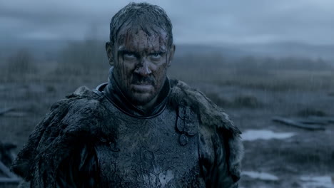 grim warrior in rain after battle