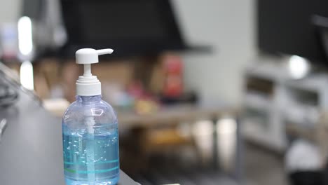 sequence of hands using a pump hand sanitizer