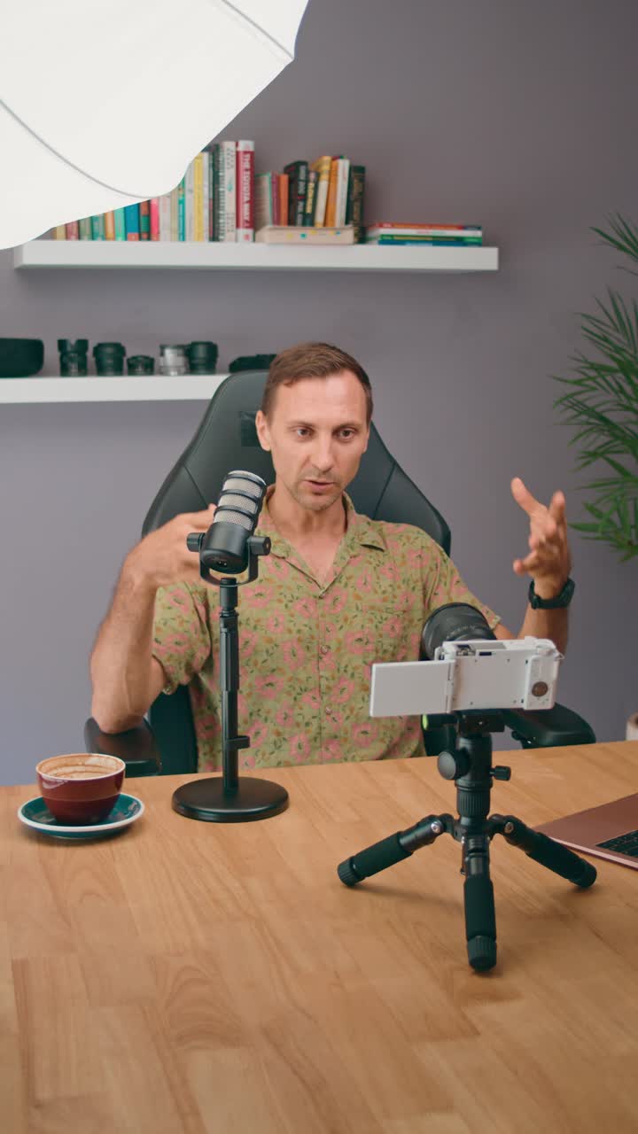 Man vlogging or podcasting at home