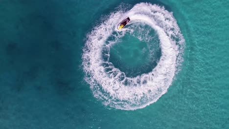 jet skiing in circles in the indian ocean