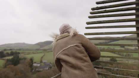 female looking out over natural vista landscape