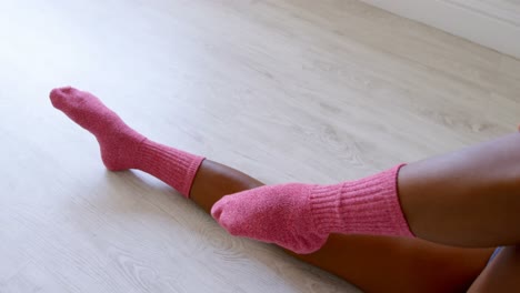 woman stretching her leg in fitness studio 4k