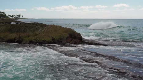 Waves-crashing-over-Oahu's-the-volcanic-rocks