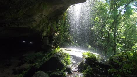 beautiful waterfall in the nature seen from the inside.