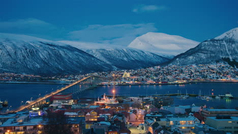 stunning cinematic wide shot of tromso at dusk