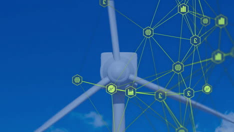 wind turbine with green network connections and financial icons against blue sky