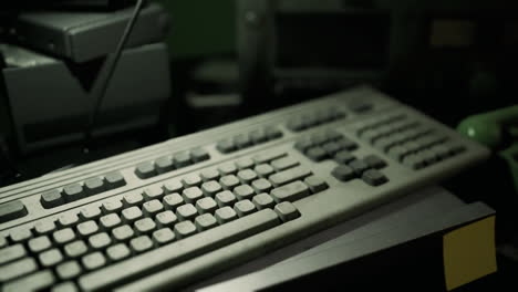 vintage computer keyboard on a dusty desk