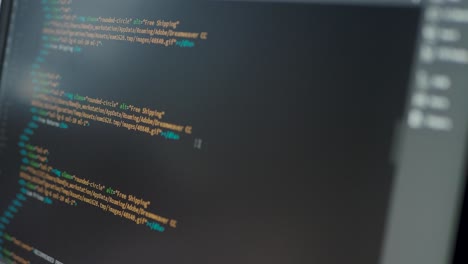 Developer is browsing html code on the computer screen