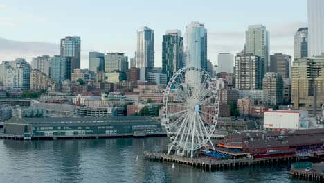 dynamic aerial of seattle's great wheel on pier 57