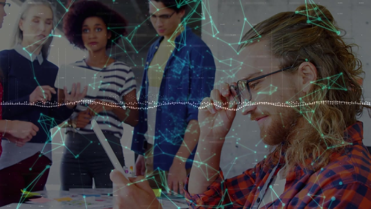 Animation of plexus network floating over caucasian man using digital tablet at office