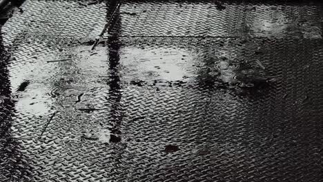 rain on a metal floor