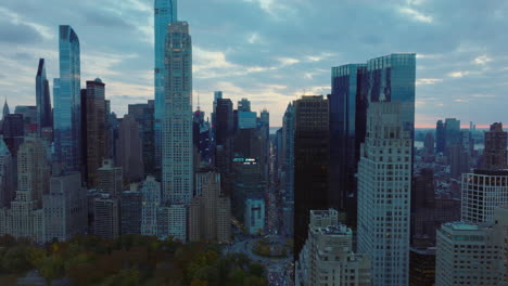 Elevated-view-of-cityscape.-Downtown-skyscrapers-and-long-straight-avenue.-Twilight-sky-with-clouds.-Manhattan,-New-York-City,-USA