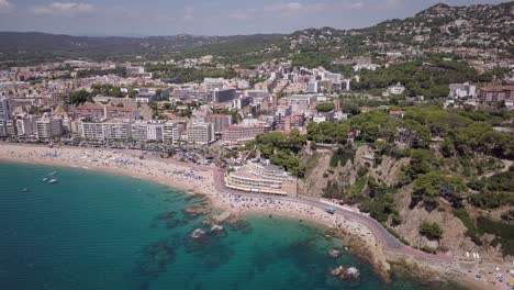 busy tourist beach of lloret de mar in mid summer