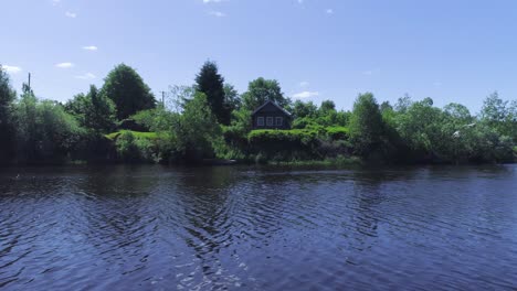 rustic wooden house by a river