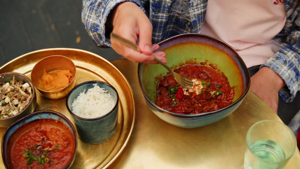 Woman enjoying a delicious Indian meal
