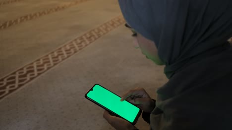 watching woman green screen smarthphone