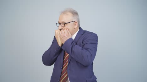 Stressed-businessman-biting-nails.