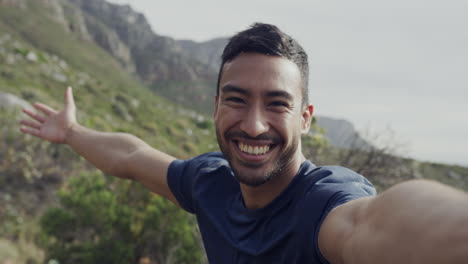 man taking a selfie in the mountains