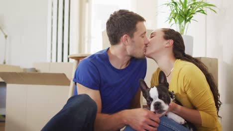 Happy-caucasian-couple-in-love-hugging-and-kissing-at-home