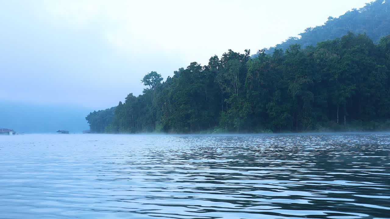 Serene river with misty mountains in Chiang Mai