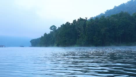 serene river with misty mountains in chiang mai