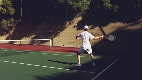 man playing tennis on a sunny day