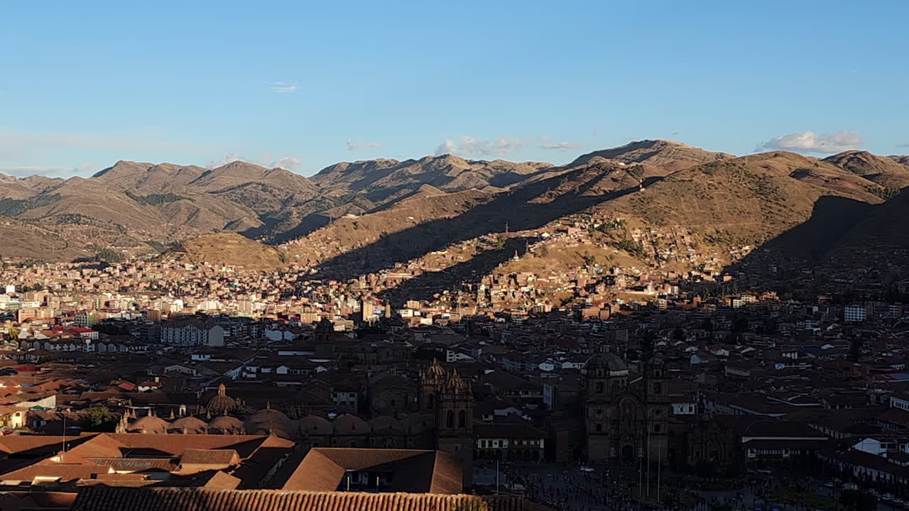 The incredible historic city of Cusco, nestled in the Andes Mountains. The footage showcases the unique urban landscape and surrounding majestic scenery