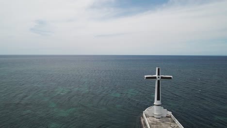 above famous sunken cemetery in philippines with white cross landmark