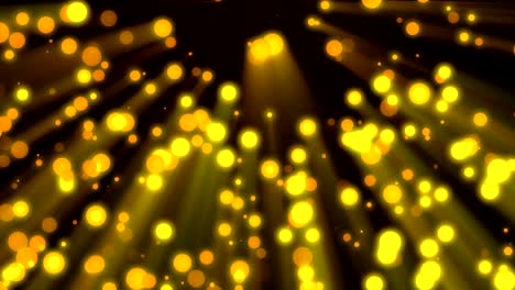 loopable background flying golden particles in light beams