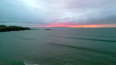 Aerial-shot-showing-West-Strand-Beach,-Portrush-on-a-moody-night