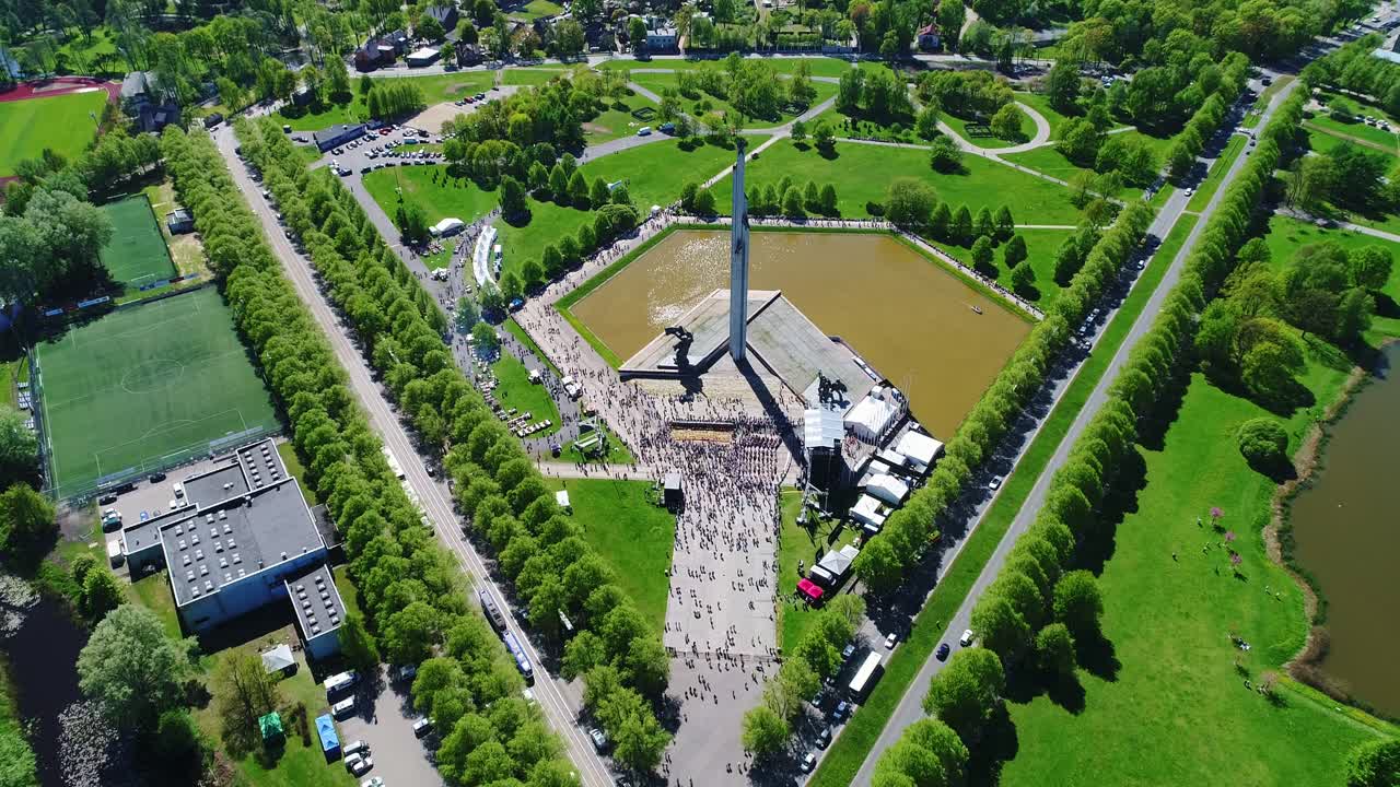 Large crowd gathering around Victory Monument in Riga, Top-down view, 05.09.2019