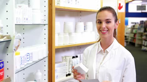 pharmacist checking at prescription and medicine box