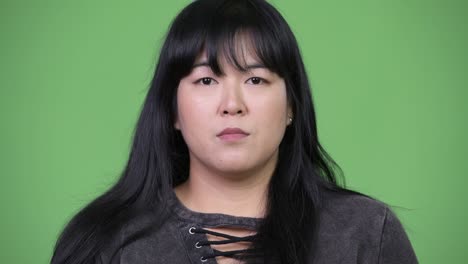 head shot of beautiful overweight asian woman smiling