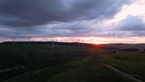 aerial footage of windfarm at sunset