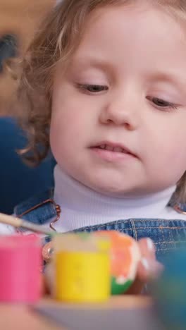 toddler engaged in art activity
