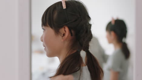 asian-mother-and-daughter-playing-dress-up-game-at-home-wearing-cat-ears-little-girl-having-fun-with-mom-enjoying-playful-day-with-child-together-on-weekend-happy-family-4k-footage