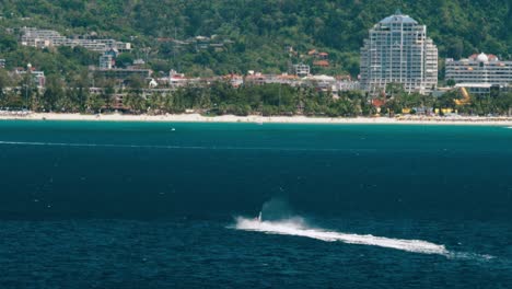 jet ski cruising at thailand beach on a sunny day