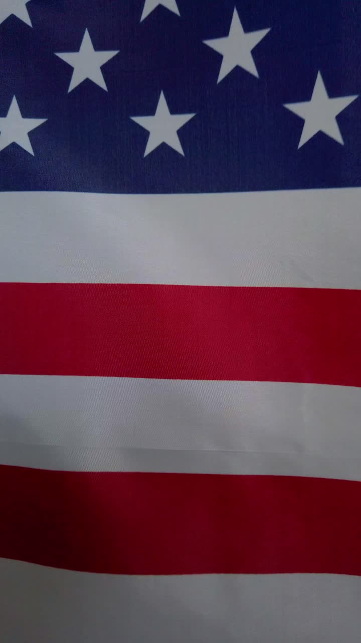 Close-up view of six American flags waving